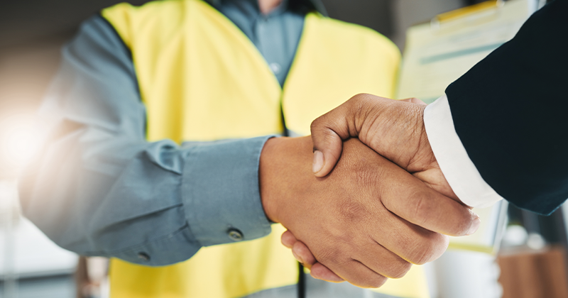 handshake of construction managers symbolizing collaboration in construction